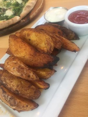 Potato wedges with aoli and ketchup. at Real Food Daily - Pasadena in Pasadena