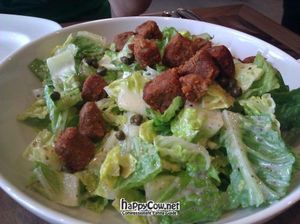 Caesar salad topped with BBQ tempeh cubes at Real Food Daily - Pasadena in Pasadena