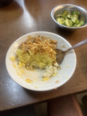 layers of tumeric & corn sticky ricee  at Hanoi Vegan Food Tours in Hanoi