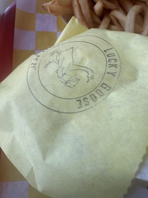 Packaging on the Burger it came in, a goose with a cleaver…. clever  at Lucky Goose  in Albuquerque
