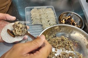 preparing the popular 100% plant based mushroom dumplings at Noodles Now in Koh Samui