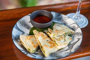 thai quesadilla with sweet 
basil pesto and yi tofu (spicy fermented tofu) cream with homemade siracha sauce at Noodles Now in Koh Samui