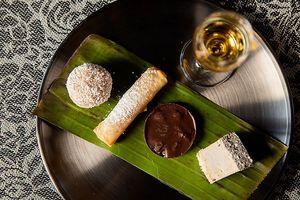 Platter of sweet morsels (entirely plant based) with glass of thai rum at Noodles Now in Koh Samui