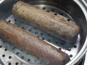 Mushroom and Galanga Salami being smoked.  Almost ready for slicing. Yum. at Noodles Now in Koh Samui