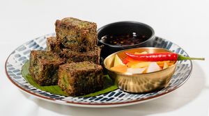 Garlic Chive Bites with Tangy Sweet Soy and Green Mando and Daikon Salad at Noodles Now in Koh Samui