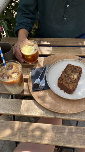 Iced latte with oat milk, espresso tonic, vegan banana bread  at Hana Corner Cafe in Tirana