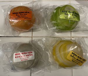 Soft cake flavors clockwise: mung bean, coconut, taro, durian.  at Đông Hưng Viên Bakery in Westminster