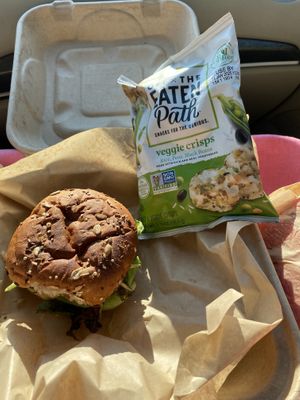 Pinto burger Togo with chips and watermelon slice.   at Viridescence Bottles and Bites in Pilot Mountain