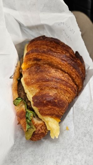 Egg and sausage on croissant at To Live For in Vancouver