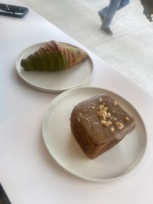 Matcha Croissant 🥐 and hazelnut chocolate croissant. This place has the flakiest croissants ever!   at To Live For in Vancouver