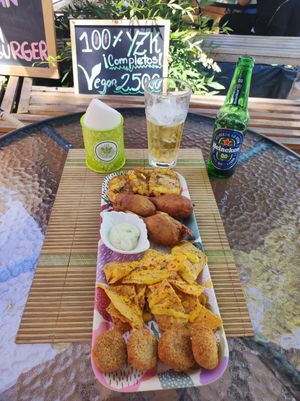 Fried plantain, not chicken legs, nachos and nuggets with garlic sauce at Yizak Vegan Food in Santiago