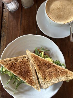 Toast with hummus, avocado, roasted pumpkin and rucola / latte with oat milk  #Veganuary at The Muffin Man in Siem Reap