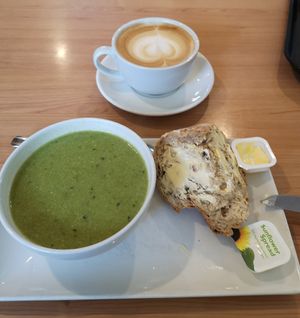 Pea and mint soup. Oat milk latte. at Crofters Cafe in Truro