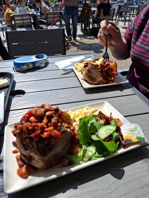 A regular favourite. Jacket potato with chilli beans, salad and vegan slaw.  Delicious. at Crofters Cafe in Truro