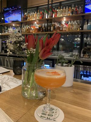 Full bar with passion fruit cocktail  at True Food Kitchen in Edison