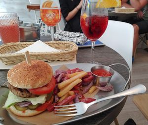 Veggie burger with colourful fries at Cat Cafe in Vilnius