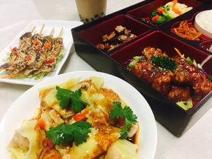 wonton in chili oil, calamari skewer, sweet chili chicken rice.  at Kuan Yin Tea House in Southport