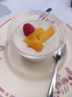 Dessert with coconut and mango at La musar'dine in Gourdon