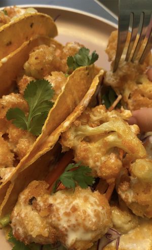 Tacos with cauliflower wings!   at Flora Vegan Cafe in Tamarindo