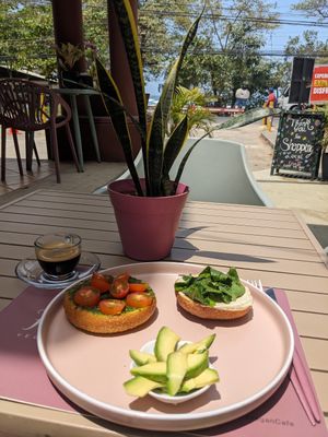 Savory bagel with vegan herb cream cheese and pesto at Flora Vegan Cafe in Tamarindo