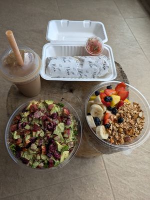 Iced coffee, superfood power salad, granola and fruit bowl, and breakfast burrito 👍👍 at Flora Vegan Cafe in Tamarindo