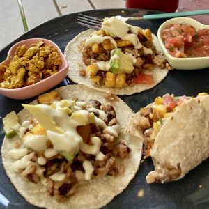 El Tico, Gallo Pinto topped with sweet plantains, avocado and house-made mayonnaise. Side of tofu and pico. Divine.  at Flora Vegan Cafe in Tamarindo