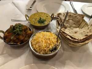 Our vegan dinner: aloo gobi, tadka dal, saffron rice, and roti.  at Arya Indian Restaurant in Narre Warren South
