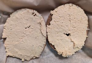 pumpernickel bagel toasted with hummus at Henry Higgins Boiled Bagels - Sellwood in Portland