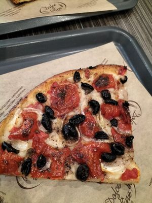 Focaccia with onions tomatoes and olives at Panificio Dolce & Pane in Bari