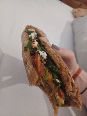 Vegan baguette with pesto, avocado, carrot, tomato, feta at Cafe Dreifünf in Berlin