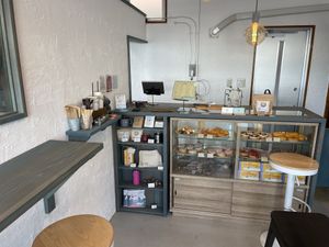 Order counter with a selection of (non-vegan) donuts  at Klatch Coffee in Ishigaki