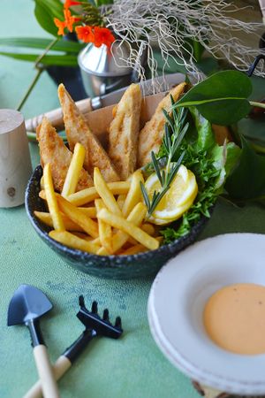 Enjoy this delicious plant-based version of the classic Fish and Chips while caring for the planet. Using Batter Crispy fish fillet from Omnimeat at Groove & Greens Café in Nonthaburi