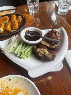 (Back) sizzling tofu in house special sauce (front) Peking d’ck  at Tofu Vegan - Spitalfields in East London
