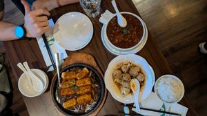 Sizzling tofu, wontons, and silken tofu in savory sauce at Tofu Vegan - Spitalfields in East London