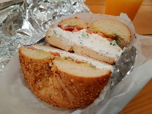Onion bagel with scallion tofu spread, avocado, and tomato at Kossar's - Lower East Side in New York City