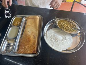 Masala dosa (left) and appam with peas curry (right)   at Pumpkin Veg Restaurant in Kochi