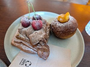 Cherry danish and puffy ball filled with orange filling. at KŸNO in Brno