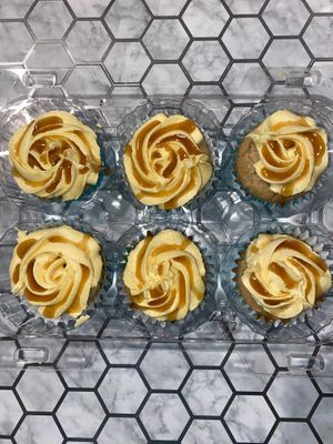 Gluten friendly bananas foster cupcakes with caramelized banana filling and French vanilla buttercream drizzled with rum caramel at FraNita's Vegan Desserts & Treats in Panama City