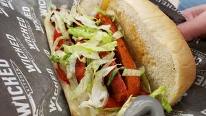 Grilled chorizo brat ($17). Decent. Brat was a little mushy. at Wicked Kitchen - Food Stand in Minneapolis