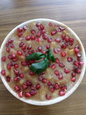 Porridge stew (not oatmeal). Slightly sweet. Pomegranate, apple, cinnamon, coconut. at Sat Saheb in Kathmandu