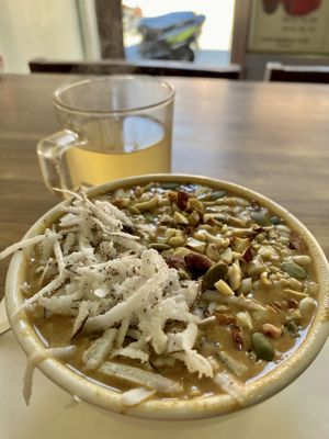 Fresh power pudding (small size) and herbal tea (large size)  at Sat Saheb in Kathmandu