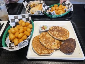 Pancakes with sausage and the breakfast sandwich  at Vine Vegan in Brandon