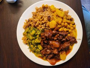 Citrus 🐔, chick pass and chana, rice and peas, calaloo and okra at Starving Vegan in Brooklyn