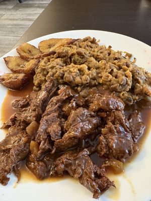 Citrus chicken with plantain and peas  at Starving Vegan in Brooklyn