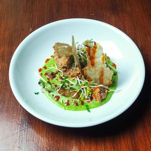 Walnut lentil tartar         
with wild garlic vichyssoise, buckwheat and onion crackers, juniper gel and smoked paprika oil at Vaust Braugaststatte in Berlin