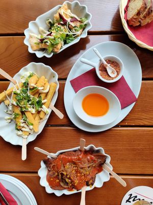 Fried 'Maultaschen' (kind of dumplings), Panisse (chickpea fries) and Currywurst at Vaust Braugaststatte in Berlin