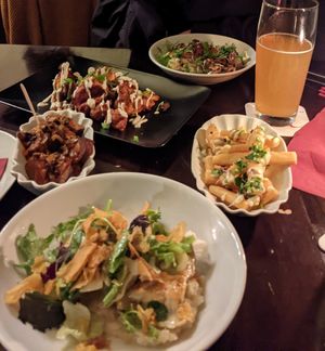Kichererbsenpommes, Currywurst, Maultaschen (vorne), Kartoffelsalat (hinten), Blumenkohl paniert at Vaust Braugaststatte in Berlin
