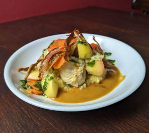 Cabbage roll
with Jerusalem artichoke and leek stuffing, Vichy carrots, potato-onion mash, braised apple and gravy at Vaust Braugaststatte in Berlin