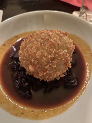 Potato dumpling filled with plum on red cabbage and winter jus   at Vaust Braugaststatte in Berlin