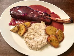 Seitan roast
with roasted parsnip stick on white cabbage, baked potatoes and pomegranate
sauce at Vaust Braugaststatte in Berlin